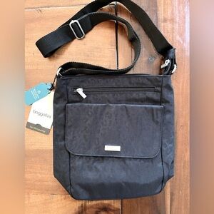 New with tags, black animal print Baggallini Town Bagg